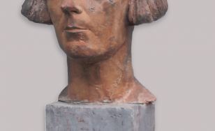 Zdjęcie przedstawia gipsową rzeźbę głowy, autorstwa Wandy Ślędzińskiej, jest ona autoportretem kobiety z krótkimi włosami.