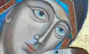 Fragment ikony przedstawia Matkę Boską tulącą do twarzy Dzieciątko Jezus. Zdjęcie skadrowane jest na same twarzy postaci, które mają złote aureole. Ich oczy są niebieskie, a rysy mocno zaznaczone.